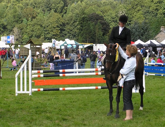 kim hamilton gets presented with her prizes by helen bowman from bhs scotland after being placed 3rd overall with onyx knight in the total saddle solutions bhs style jumping final held at blair castle on sunday 26th august. 